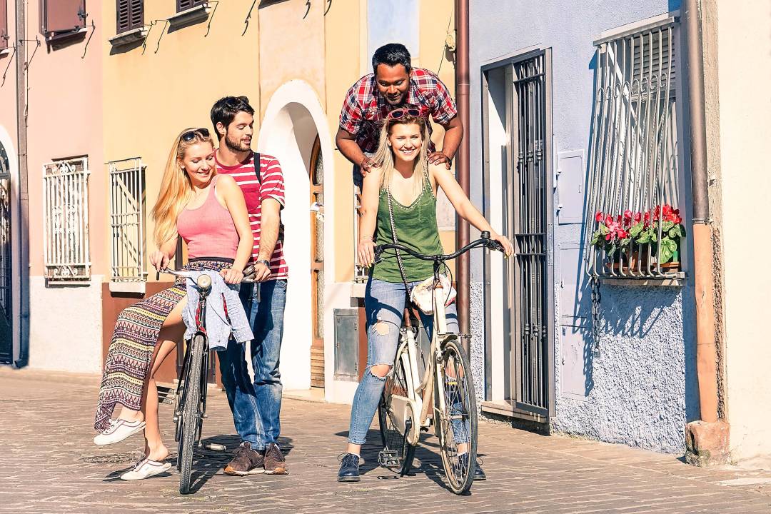 group_of_friends_riding_bike.jpg